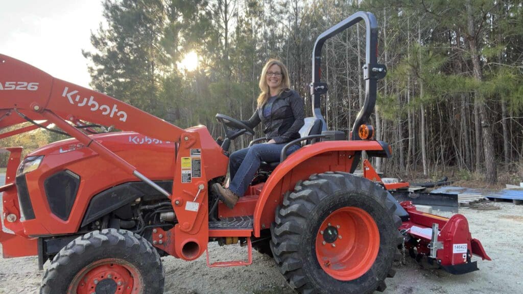 Jewel Leigh on her Kubota Tractor