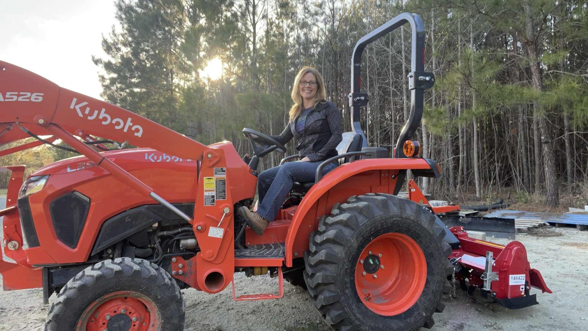 Jewel Leigh on her Kubota Tractor